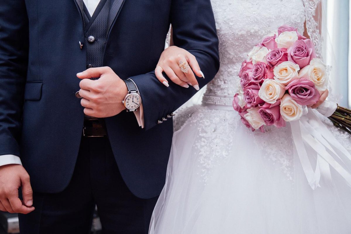 A wedding couple photographed on the day, VIP Buses wedding transport