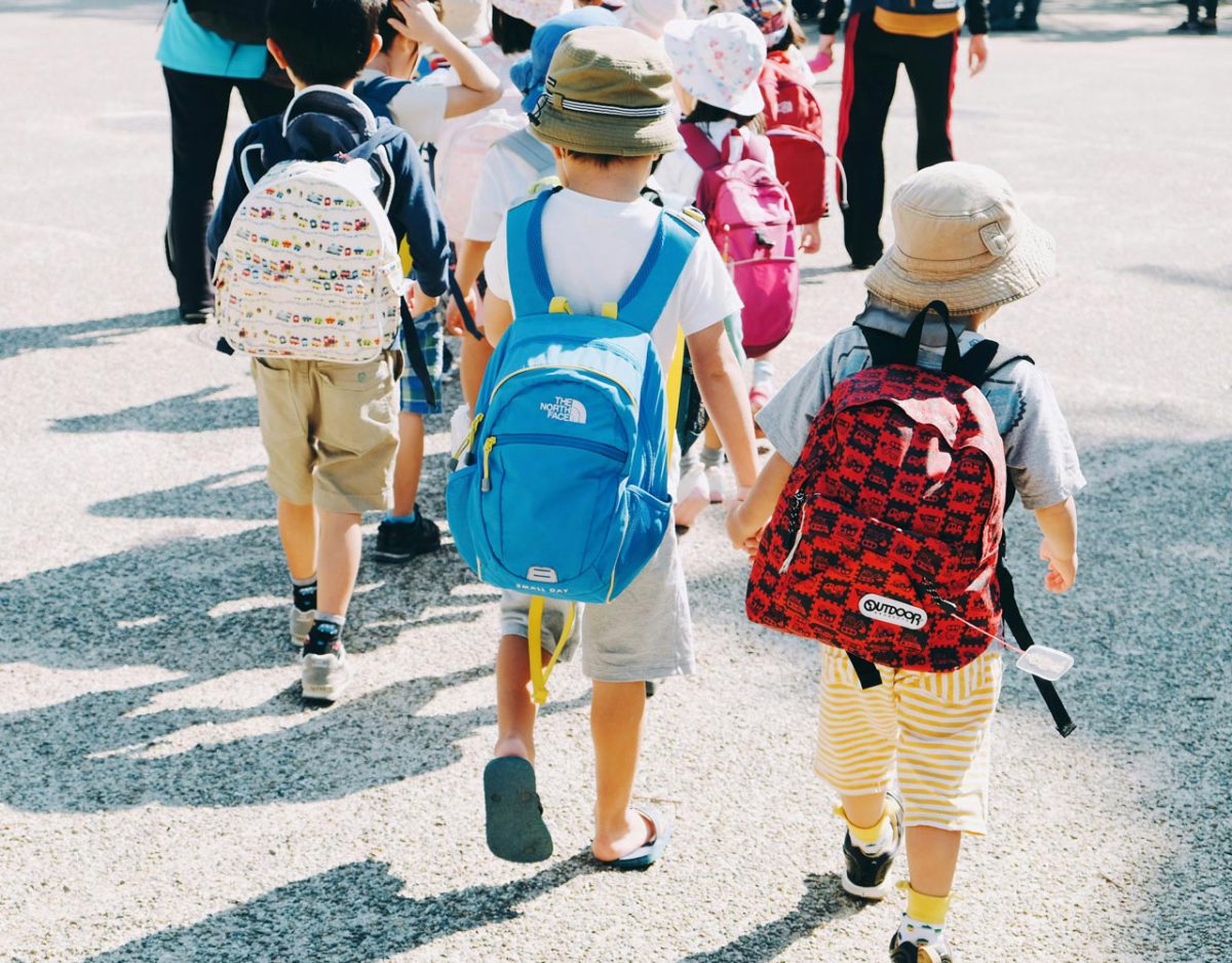 School children walking to a VIP Buses coach for a school field trip