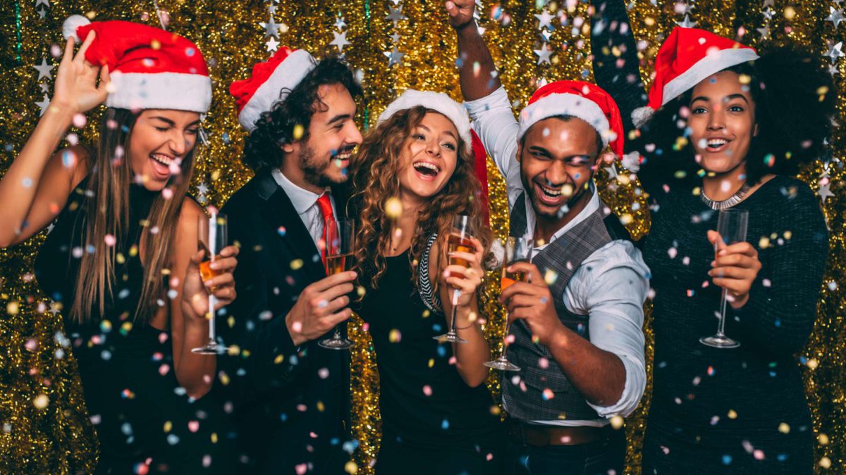 Group of People with Drinks Enjoying VIP Buses Office Christmas Party Packages in Dublin