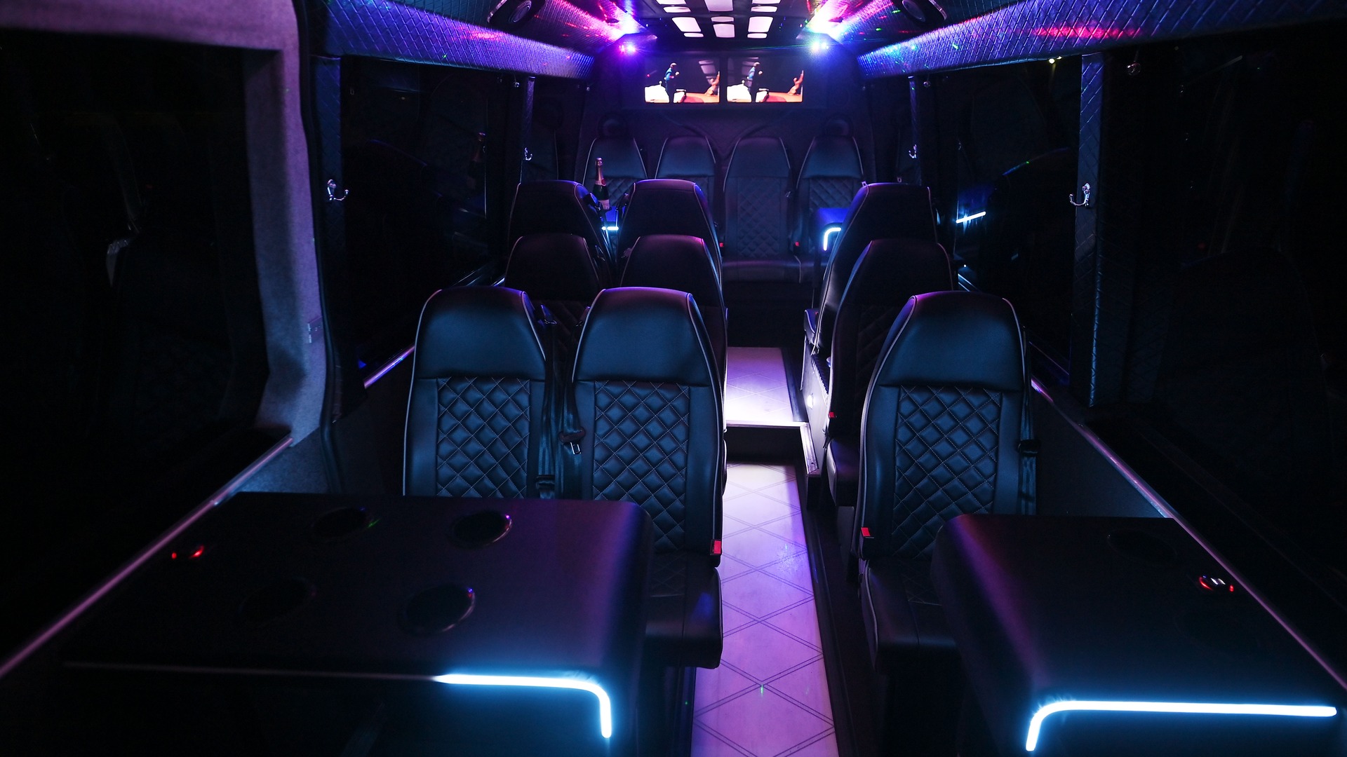 VIP Buses 2010 Mercedes Sprinter 16 Seater Party Bus aisle forward under violet ceiling light