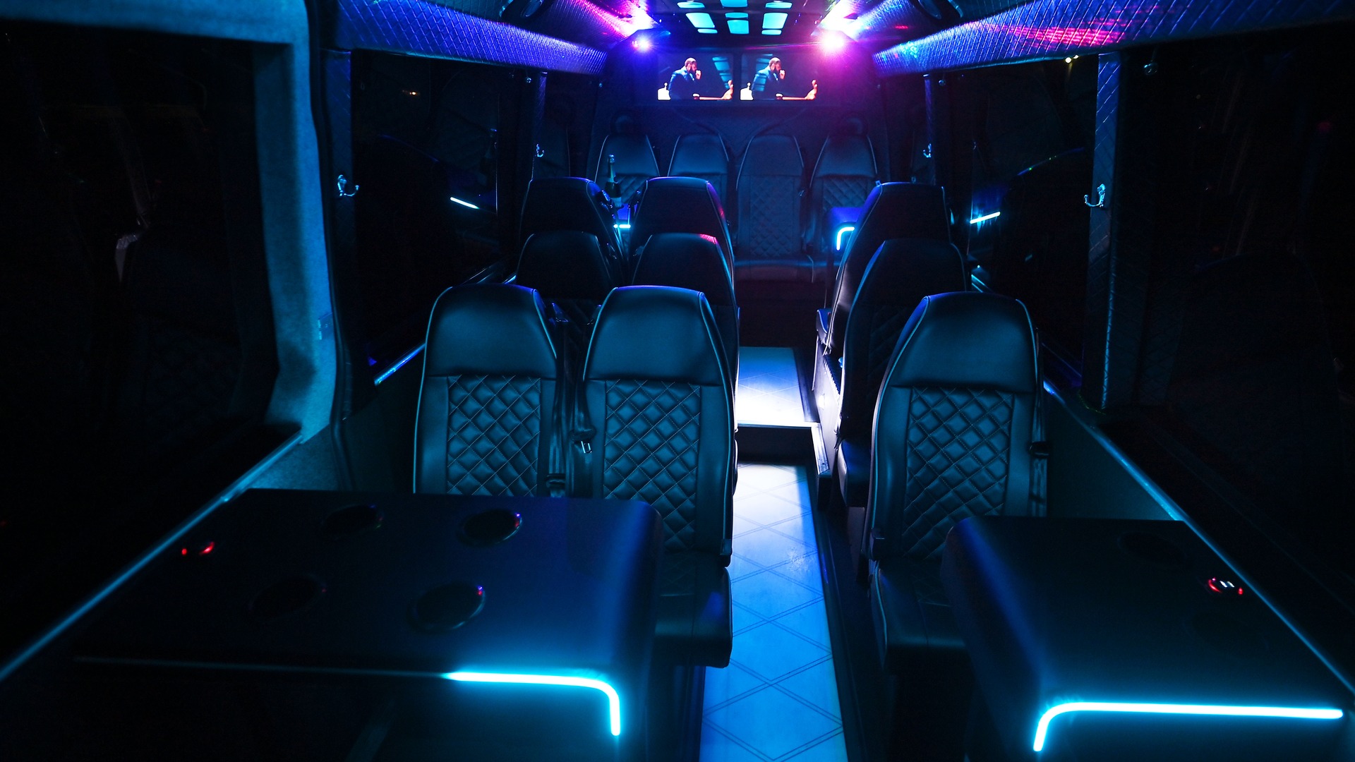 VIP Buses 2010 Mercedes Sprinter 16 Seater Party Bus aisle forward with performers on the screens