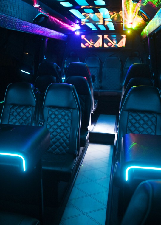 VIP Buses 2010 Mercedes Sprinter 16 Seater Party Bus aisle forward with the tables lit and lasers on the