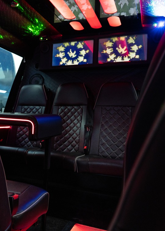 VIP Buses 2010 Mercedes Sprinter 16 Seater Party Bus rear bench and screens foreground seat at the left edge