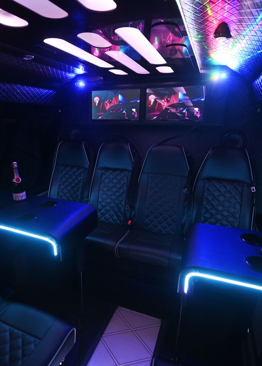 VIP Buses 2010 Mercedes Sprinter 16 Seater Party Bus rear bench and tables bottle on the left table