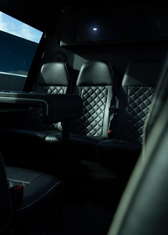 VIP Buses 2010 Mercedes Sprinter 16 Seater Party Bus rear seats seen through the doorway
