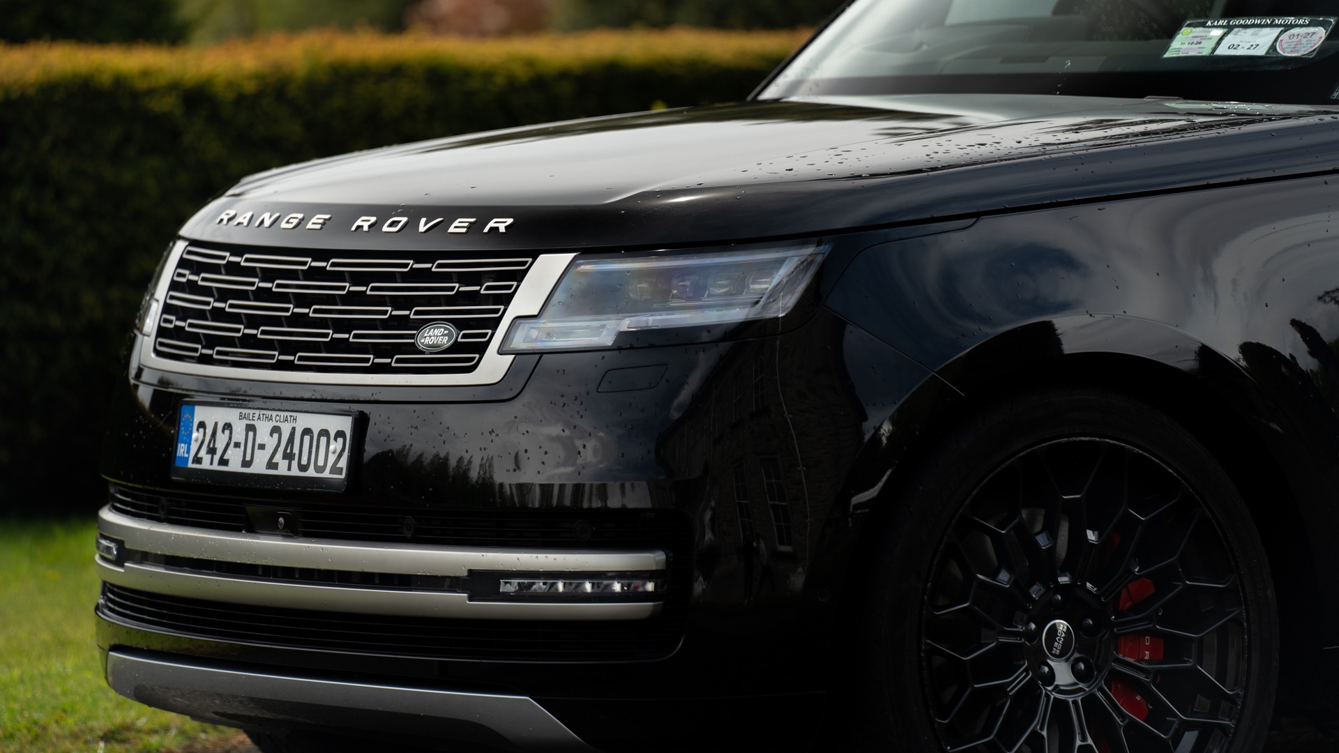 VIP Buses Black Range Rover Vogue SWB close up of the front grille and headlight