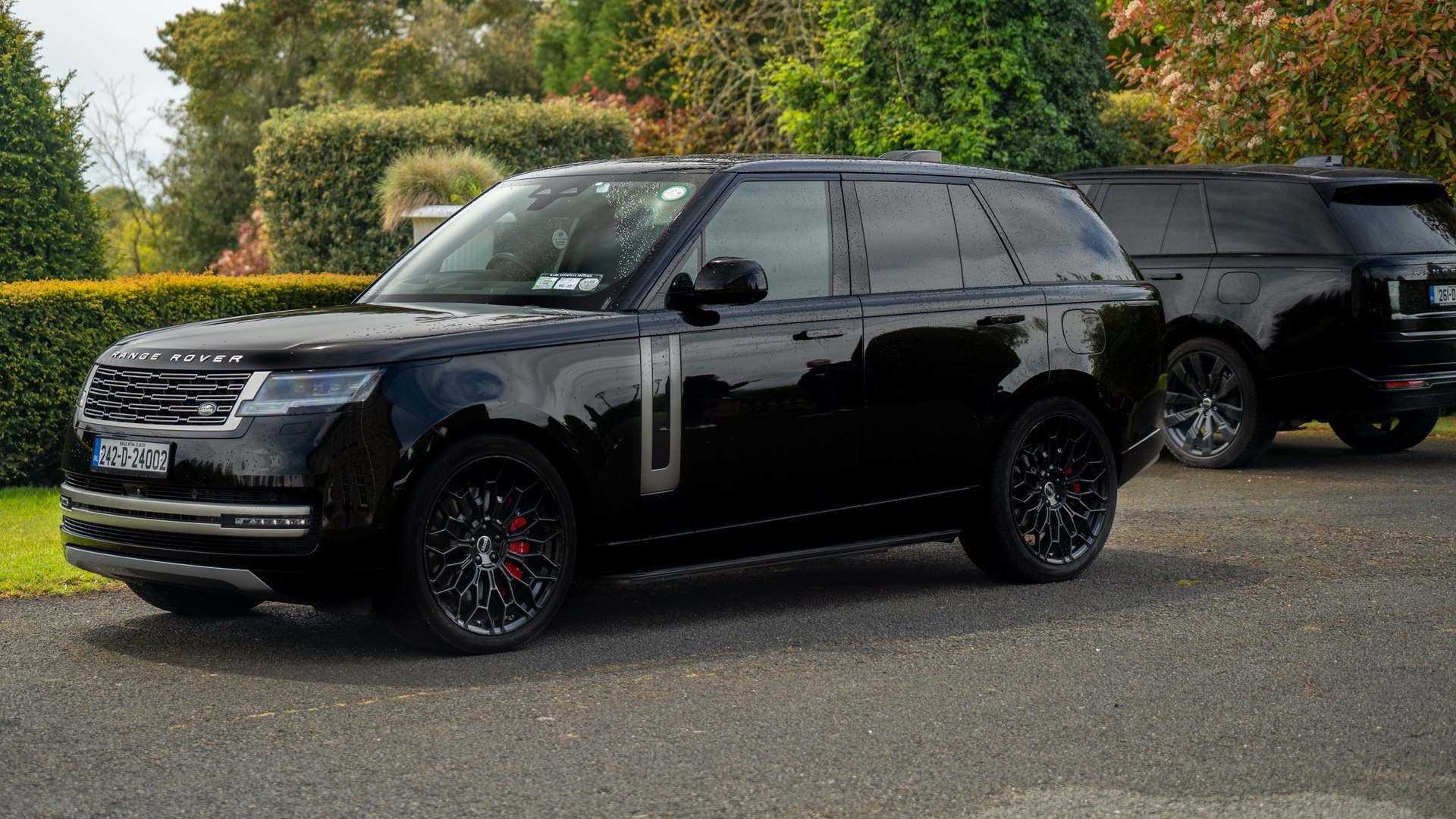 VIP Buses Black Range Rover Vogue SWB front three quarter with the second car behind