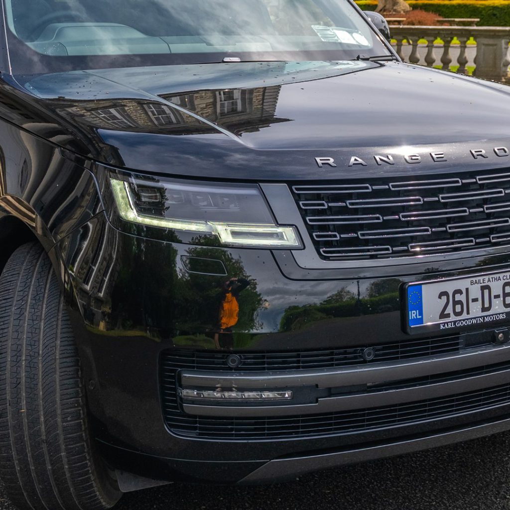 VIP Buses Black Range Rover Vogue SWB front three quarter with topiary and balustrade behind