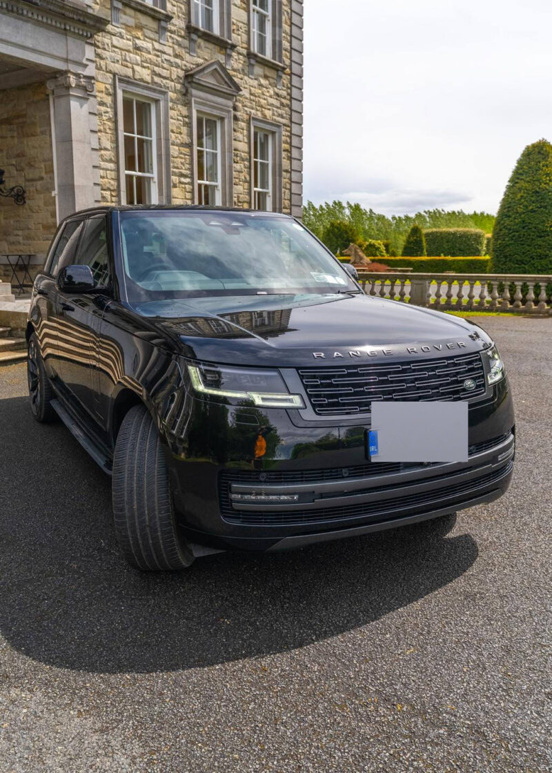 VIP Buses Black Range Rover Vogue SWB front three quarter with topiary and balustrade behind