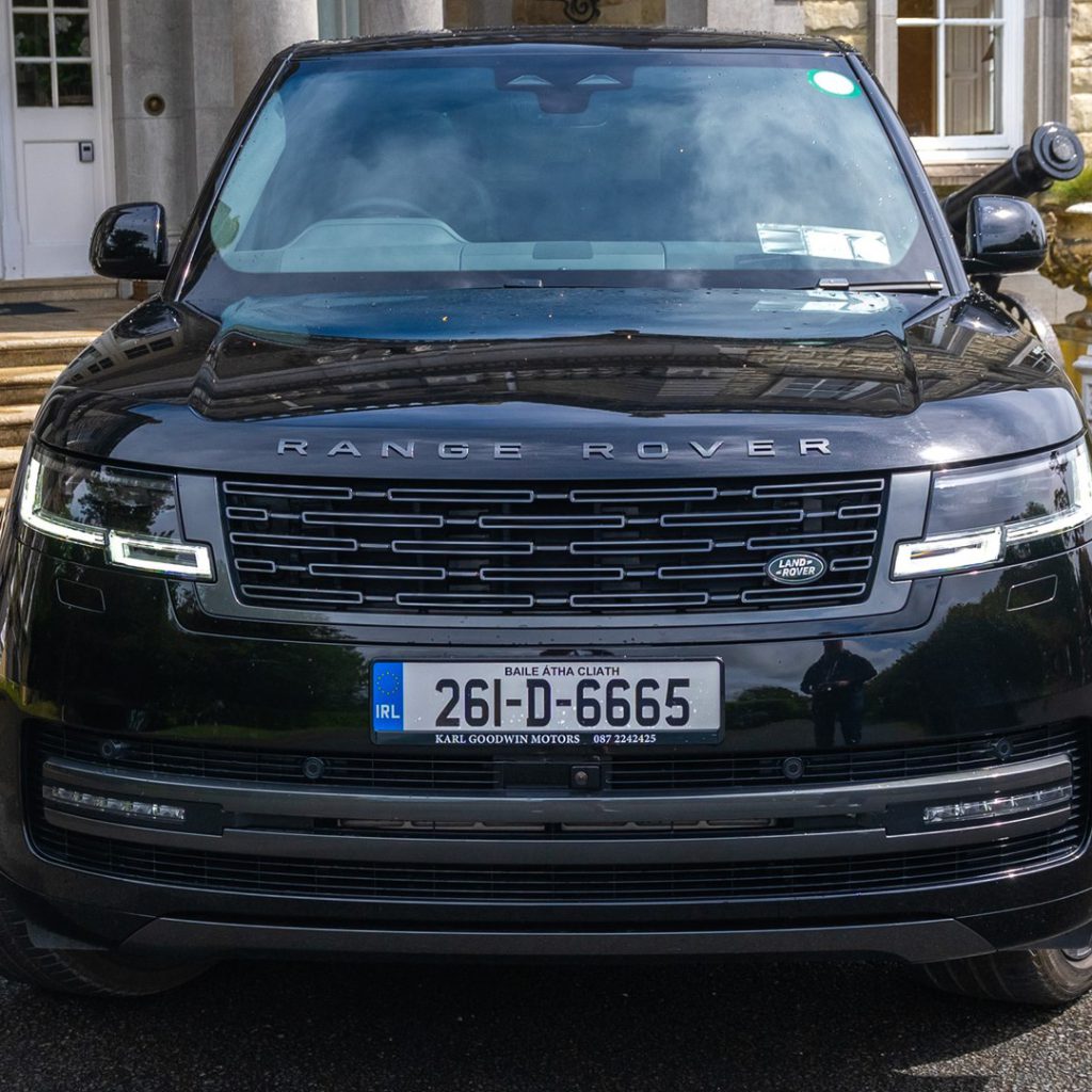 VIP Buses Black Range Rover Vogue SWB head on centred at the foot of the entrance steps