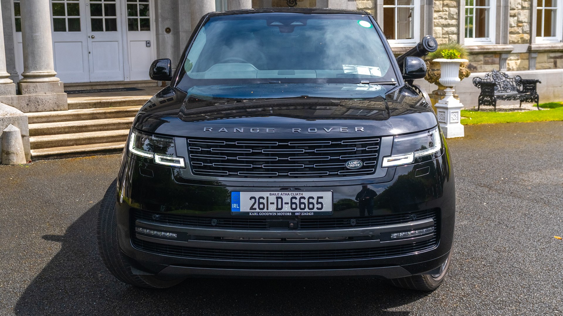 VIP Buses Black Range Rover Vogue SWB head on centred at the foot of the entrance steps