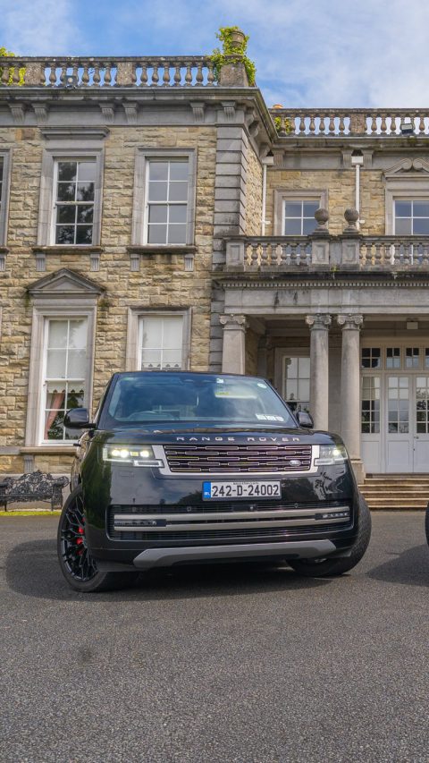 VIP Buses Black Range Rover Vogue SWB one of the pair head on before a georgian country house