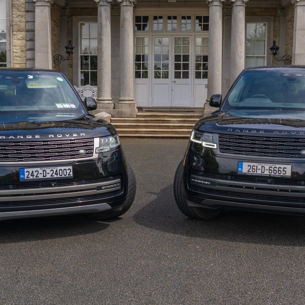 VIP Buses Black Range Rover Vogue SWB pair head on below the house facade and balustrade