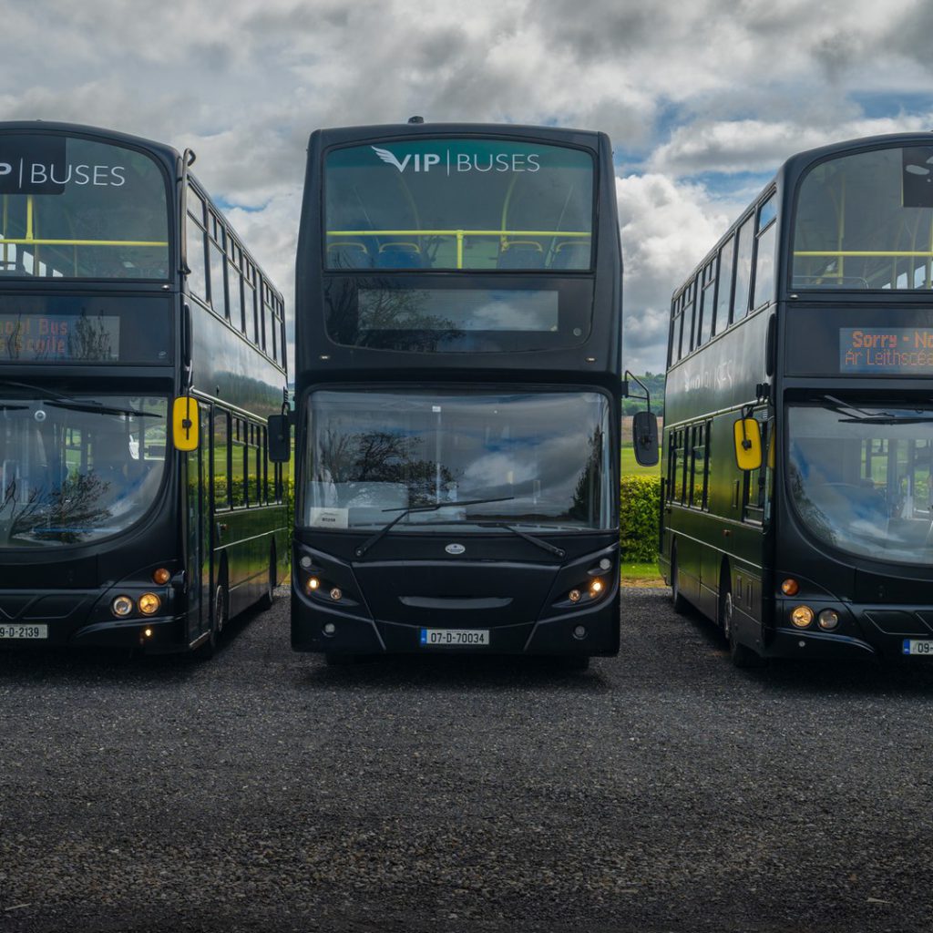 VIP Buses Double Decker Bus three parked side by side at the depot under a blue sky