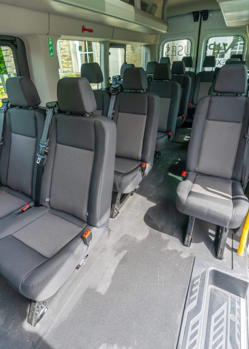 VIP Buses Ford Transit 17 Seater Minibus aisle to the rear with the boarding step