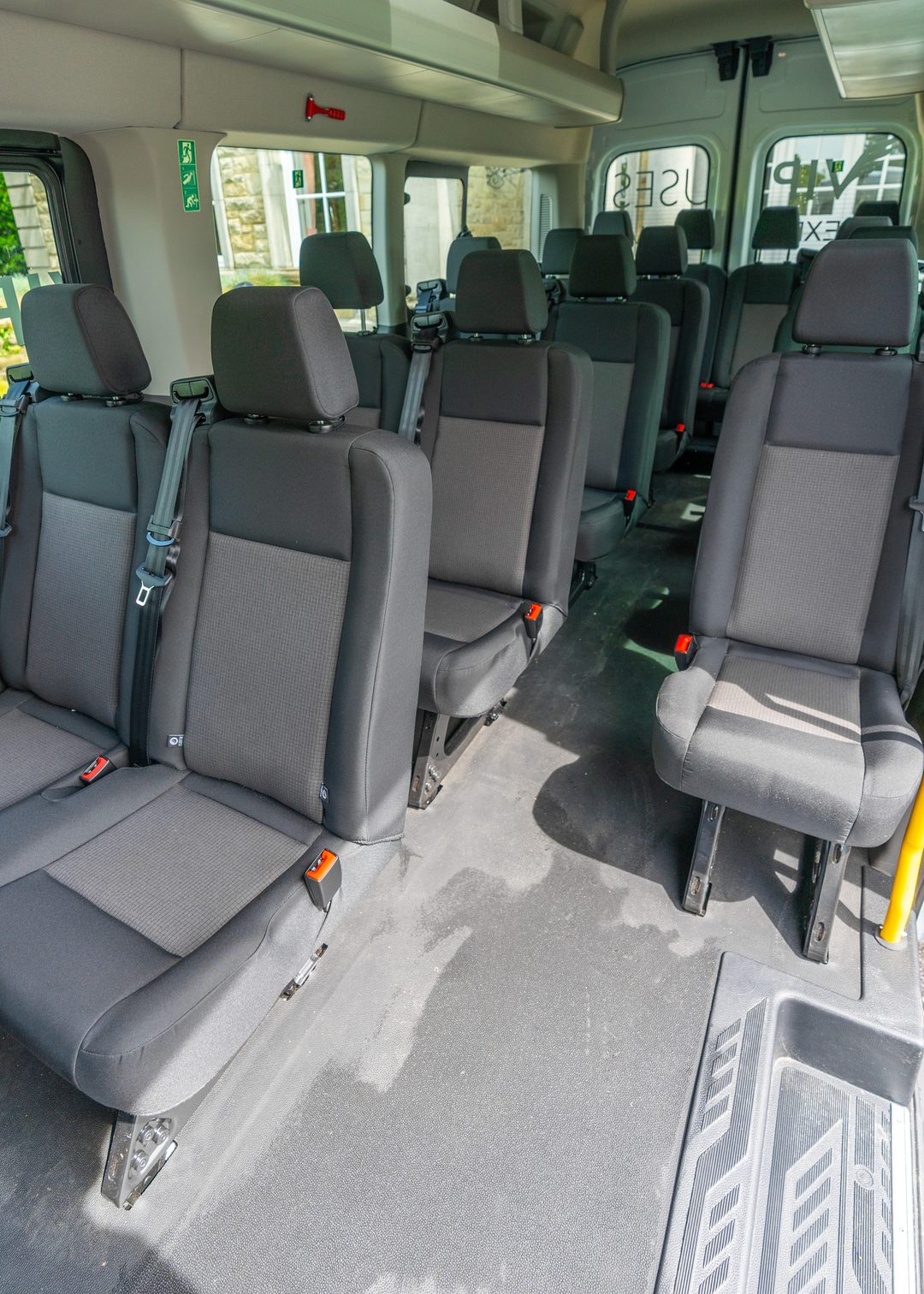 VIP Buses Ford Transit 17 Seater Minibus aisle to the rear with the boarding step