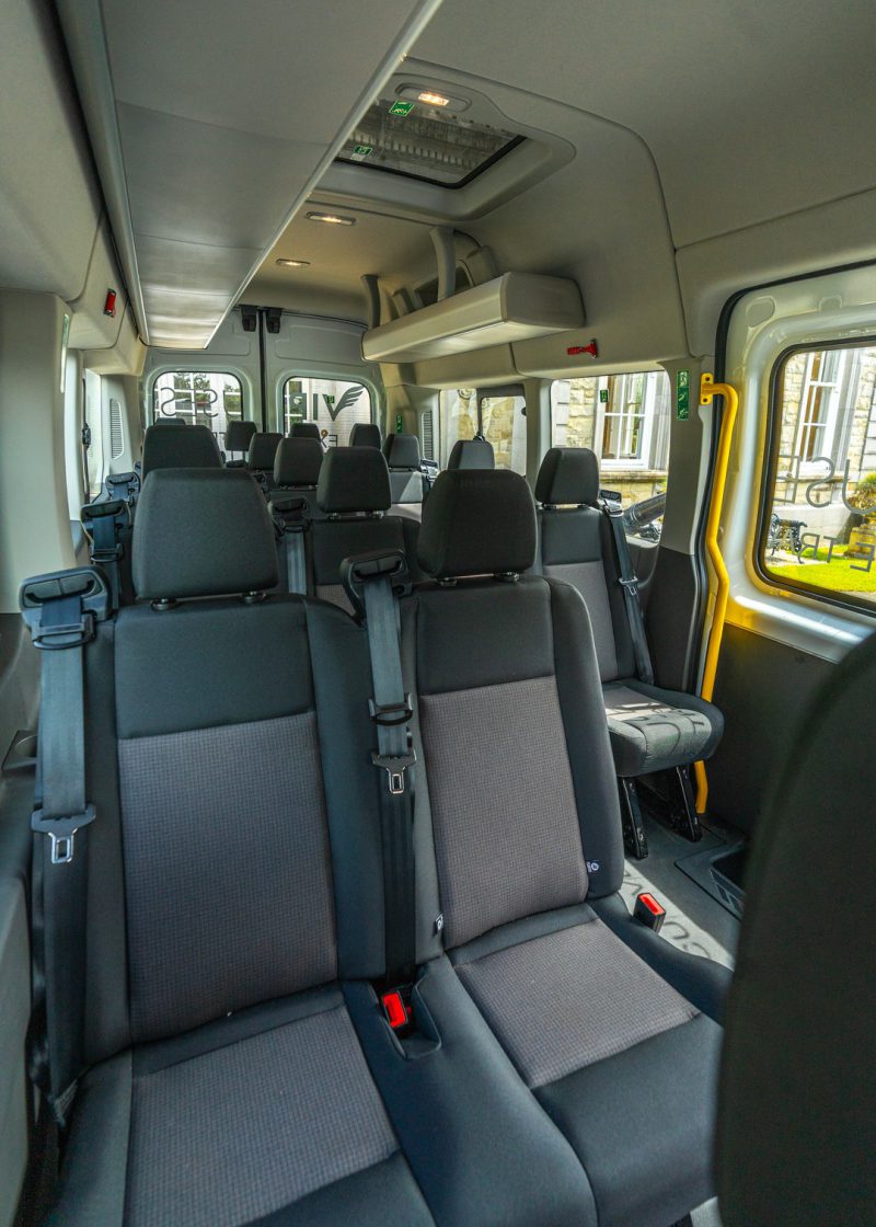 VIP Buses Ford Transit 17 Seater Minibus interior forward with the roof hatch and lockers