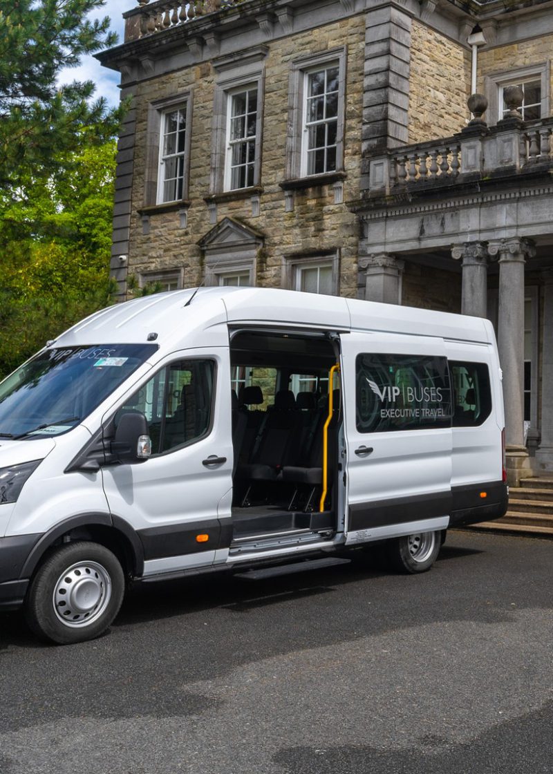 VIP Buses Ford Transit 17 Seater Minibus side profile with the sliding door open