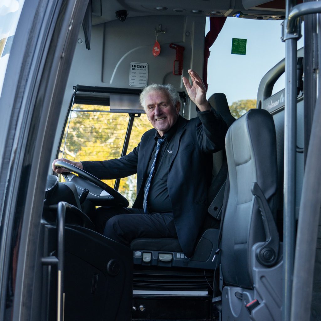 VIP Buses Higer 43 Seater Coach driver waving from the cab