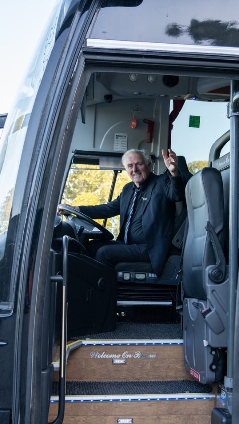 VIP Buses Higer 43 Seater Coach the driver in the open doorway