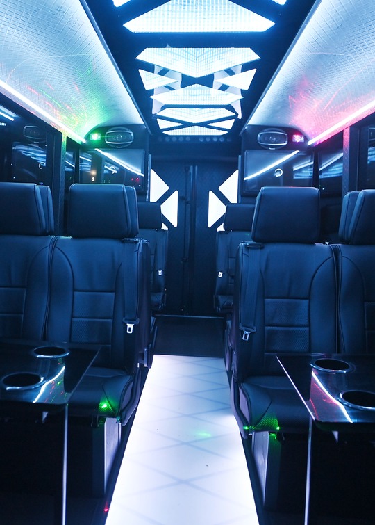 VIP Buses Iveco 16 Seater Party Bus cabin down the aisle with the mirrored ceiling