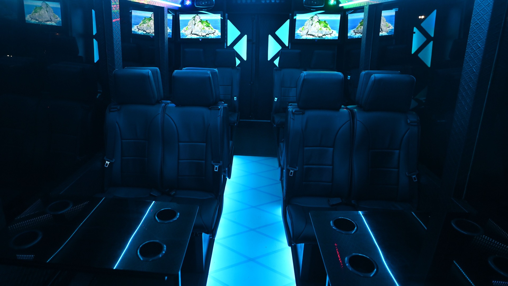 VIP Buses Iveco 16 Seater Party Bus cabin square down the aisle island scenes on every screen