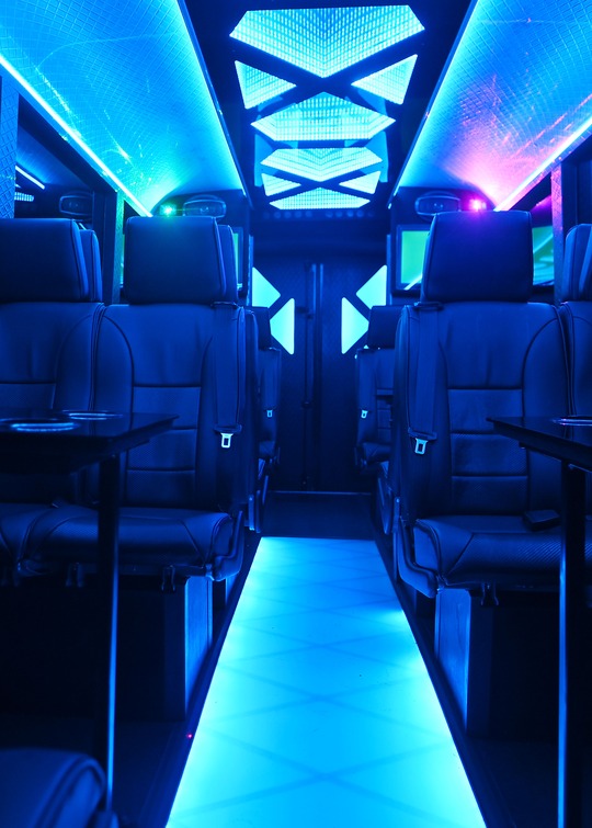 VIP Buses Iveco 16 Seater Party Bus deep blue cabin with the lit floor running away