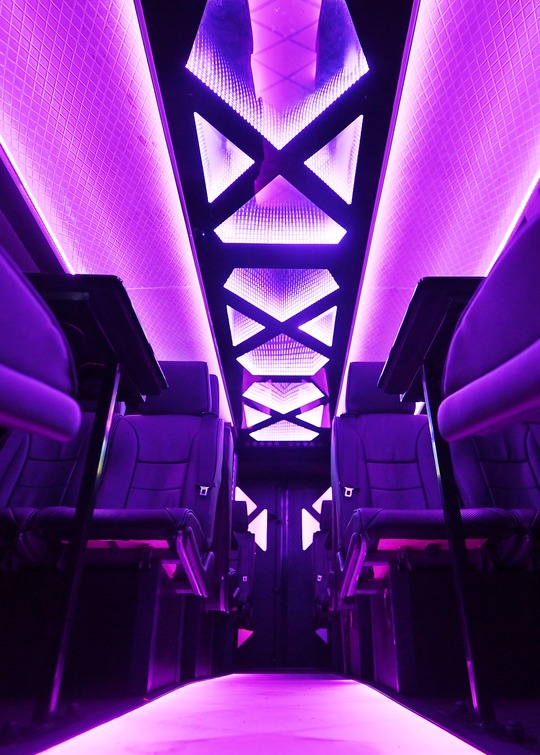 VIP Buses Iveco 16 Seater Party Bus low centred shot up the violet ceiling spine