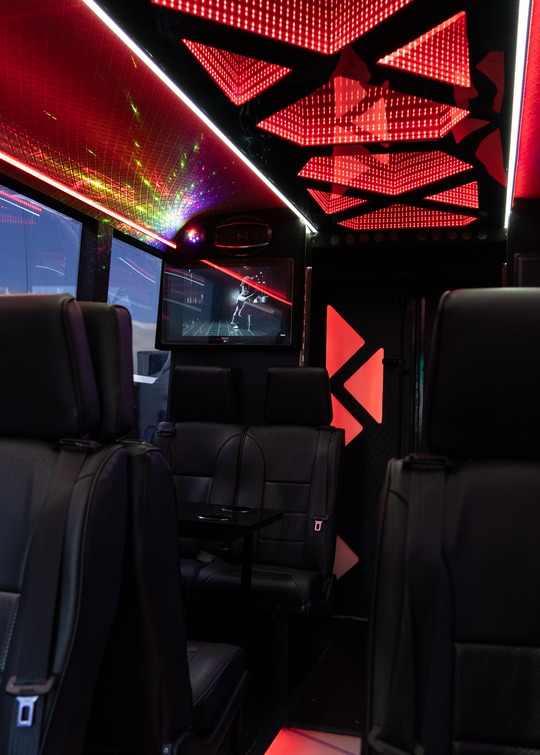 VIP Buses Iveco 16 Seater Party Bus red lit ceiling and cabin wide view