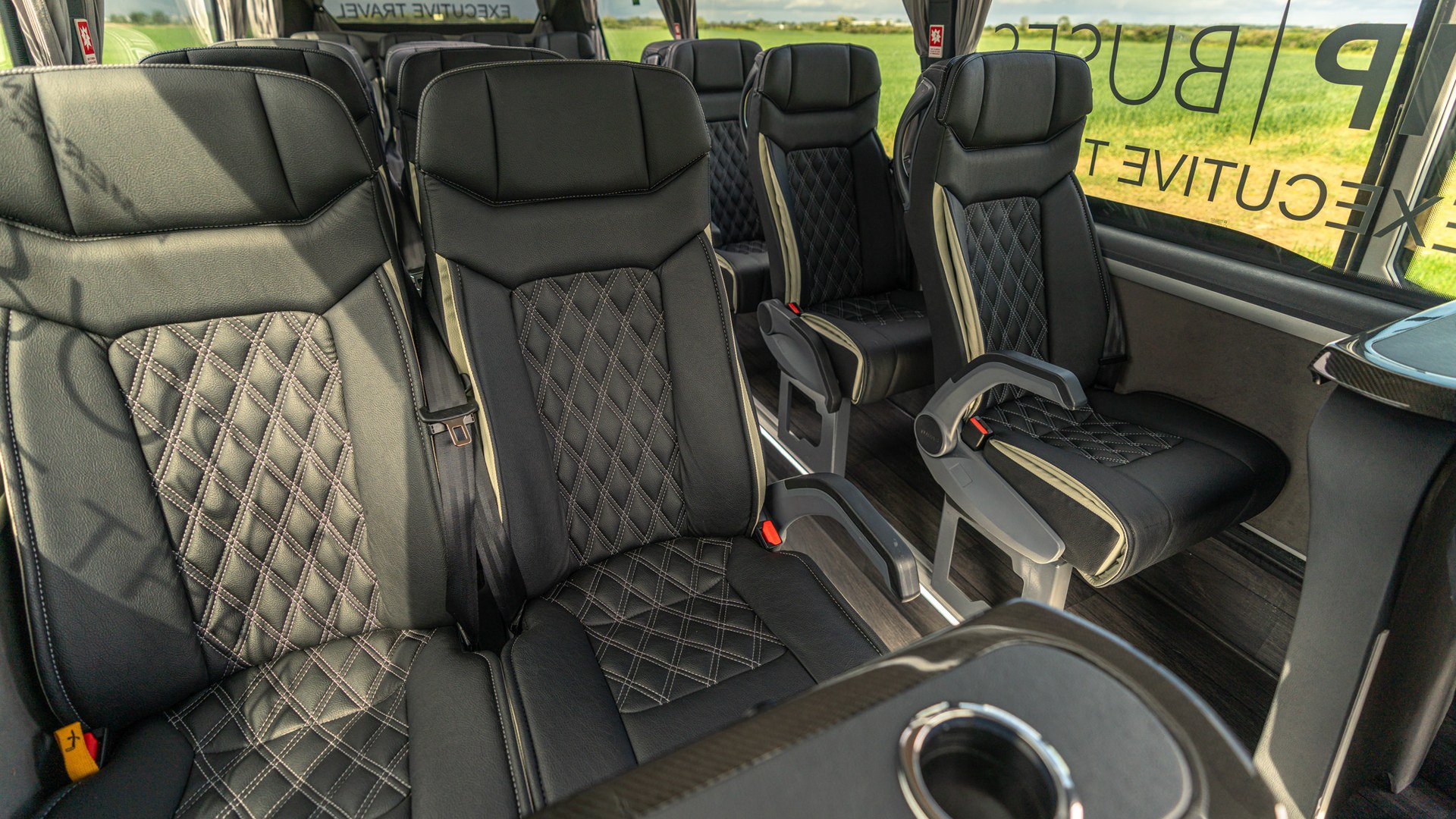 VIP Buses Mercedes Sprinter 16 Seater Minibus quilted seats with the drinks table