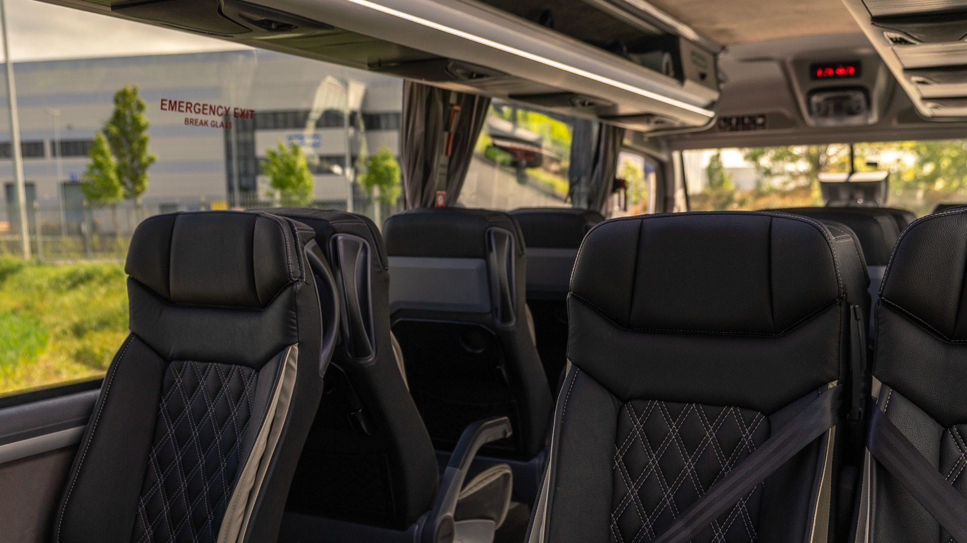 VIP Buses Mercedes Sprinter 16 Seater Minibus interior with the roof hatch open above