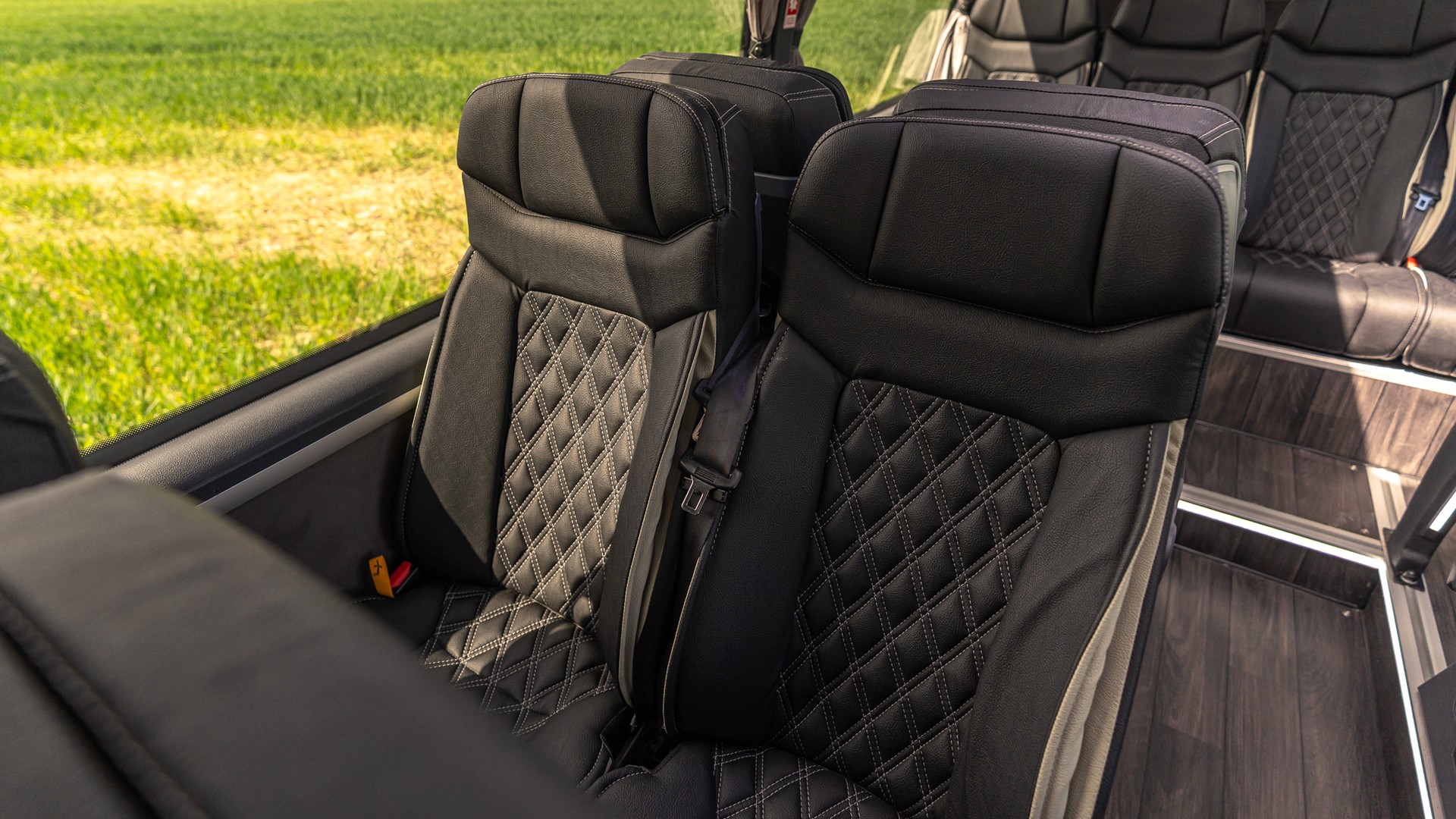 VIP Buses Mercedes Sprinter 16 Seater Minibus quilted seats over sunlit fields
