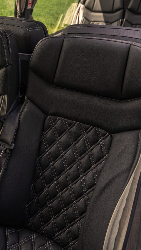 VIP Buses Mercedes Sprinter 16 Seater Minibus quilted seats over sunlit fields