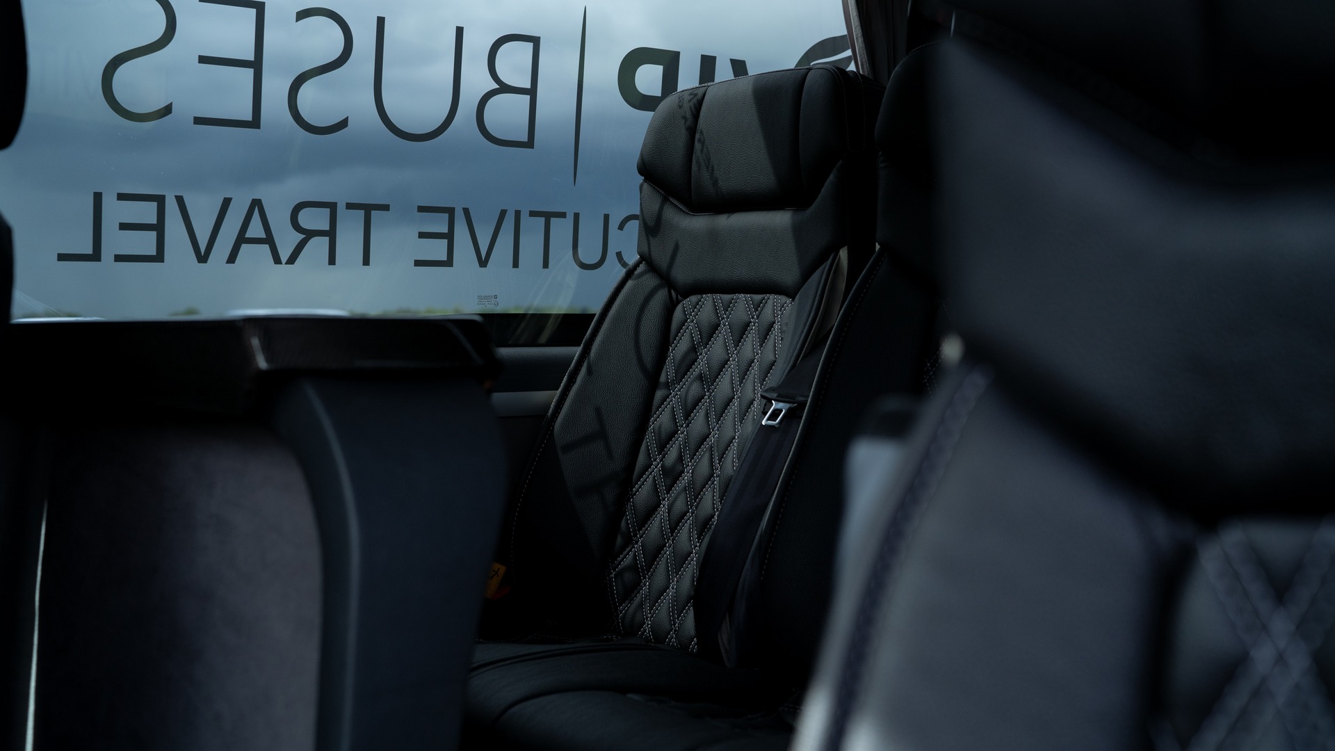 VIP Buses Mercedes Sprinter 16 Seater Minibus quilted seats with the curtains drawn open