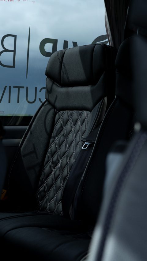 VIP Buses Mercedes Sprinter 16 Seater Minibus quilted seats with the curtains drawn open