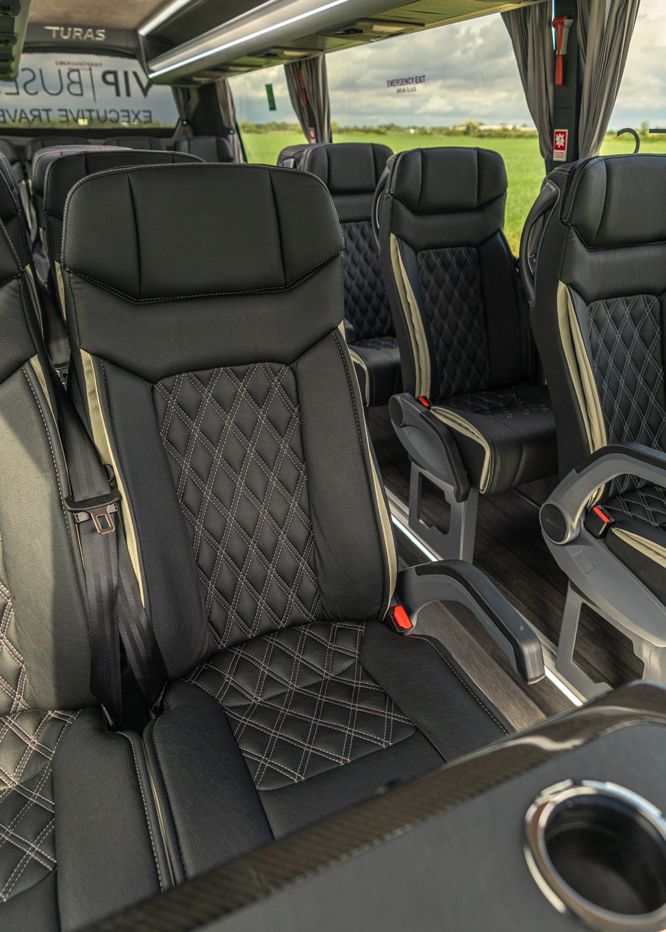 VIP Buses Mercedes Sprinter 16 Seater Minibus quilted seats with the drinks table