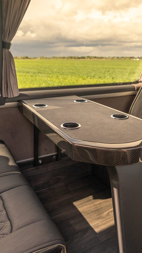 VIP Buses Mercedes Sprinter 16 Seater Minibus rear lounge facing benches at golden hour