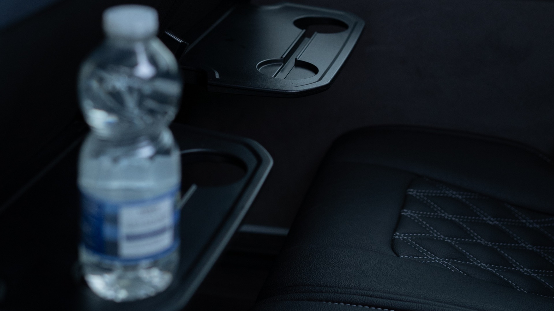 VIP Buses Mercedes Sprinter 16 Seater Minibus water bottle in a seat back tray table
