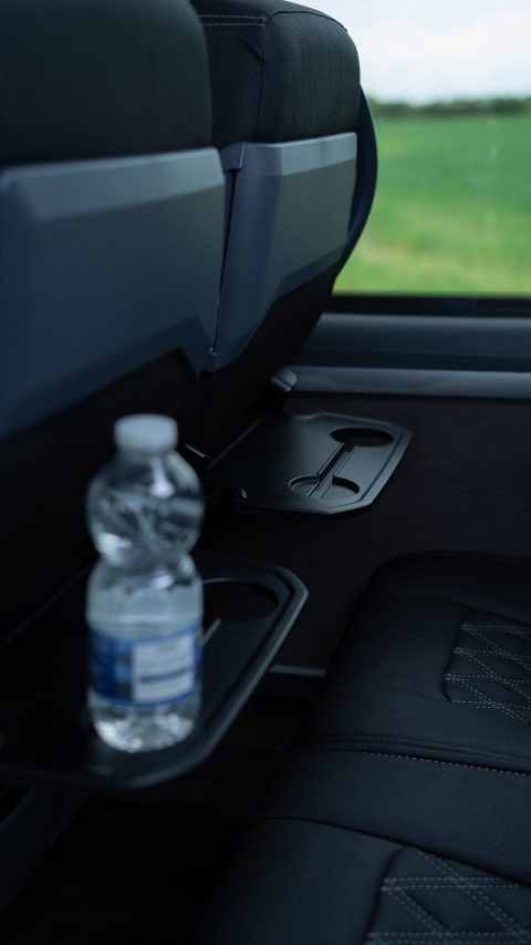 VIP Buses Mercedes Sprinter 16 Seater Minibus water bottle in a seat back tray table