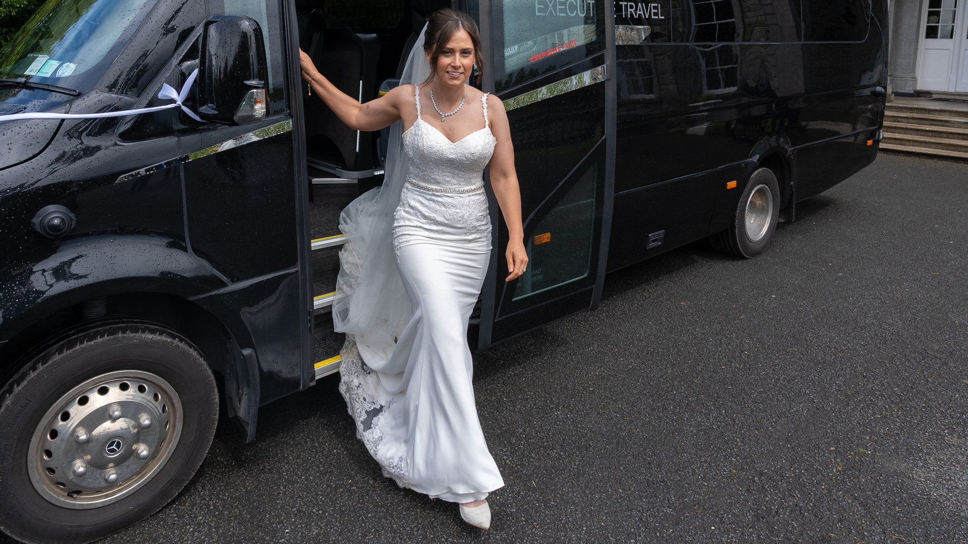 VIP Buses Mercedes Sprinter 16 Seater Minibus with the bride stepping down from the doorway