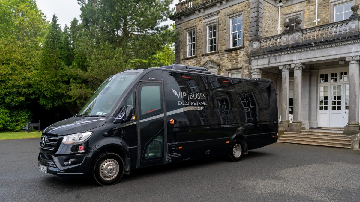 VIP Buses Mercedes Sprinter 16 Seater Minibus with the door open beside the house entrance