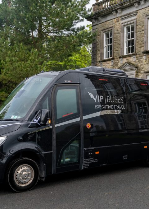 VIP Buses Mercedes Sprinter 16 Seater Minibus with the door open beside the house entrance