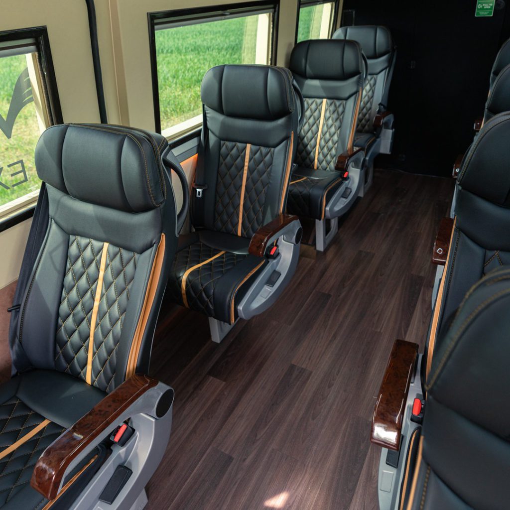 VIP Buses Mercedes Sprinter 9 Seater Minibus aisle from the front with wood effect floor
