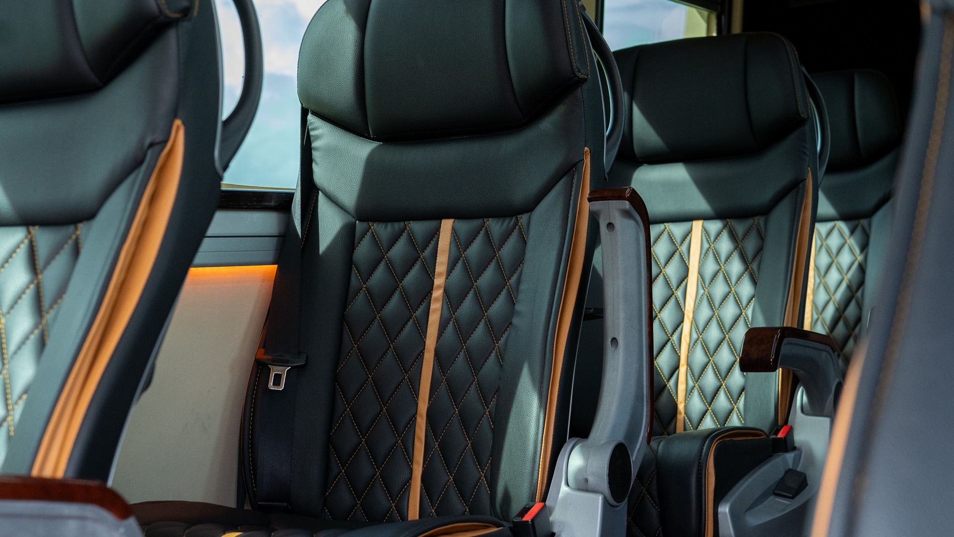 VIP Buses Mercedes Sprinter 9 Seater Minibus aisle past four rows of quilted seats
