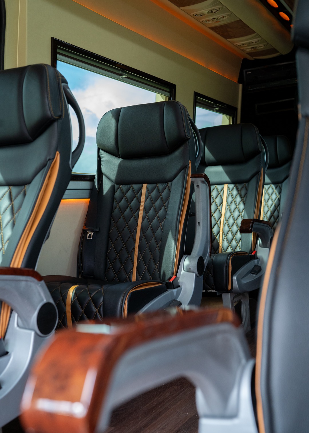 VIP Buses Mercedes Sprinter 9 Seater Minibus aisle past four rows of quilted seats