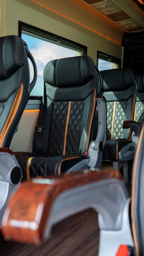 VIP Buses Mercedes Sprinter 9 Seater Minibus aisle past four rows of quilted seats