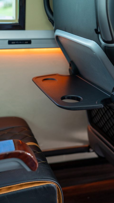 VIP Buses Mercedes Sprinter 9 Seater Minibus folding tray table down from the seat back