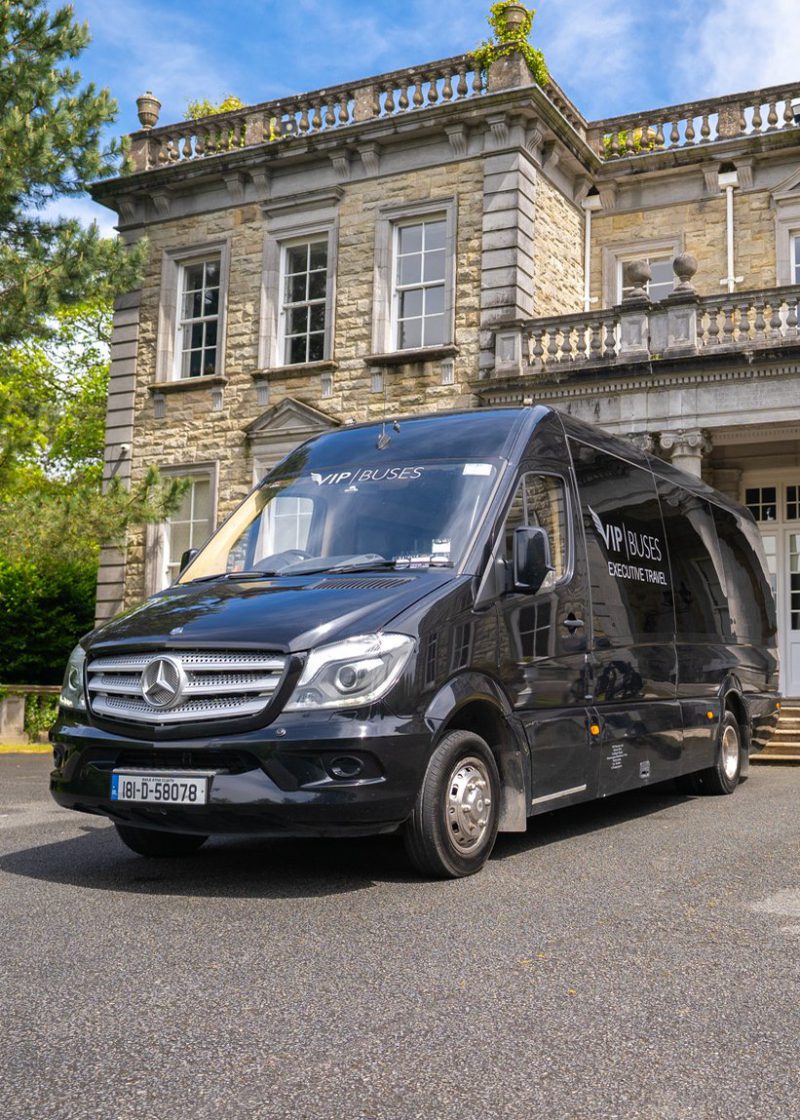 VIP Buses Mercedes Sprinter 9 Seater Minibus front three quarter beside a cannon