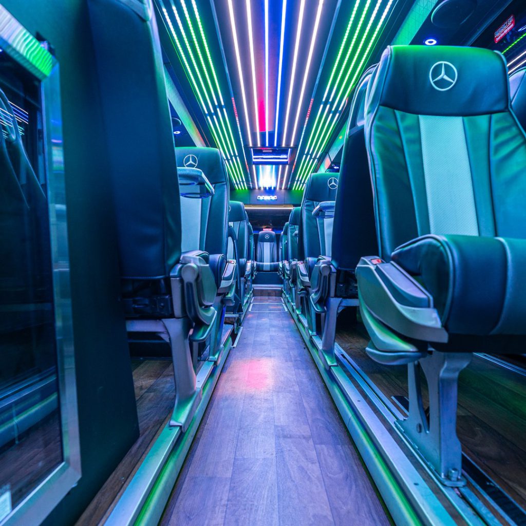 VIP Buses Mercedes Turismo 41 Seater Coach aisle at night with the drinks fridge on the left