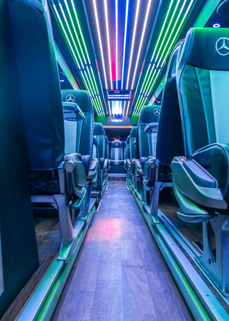 VIP Buses Mercedes Turismo 41 Seater Coach aisle at night with the drinks fridge on the left